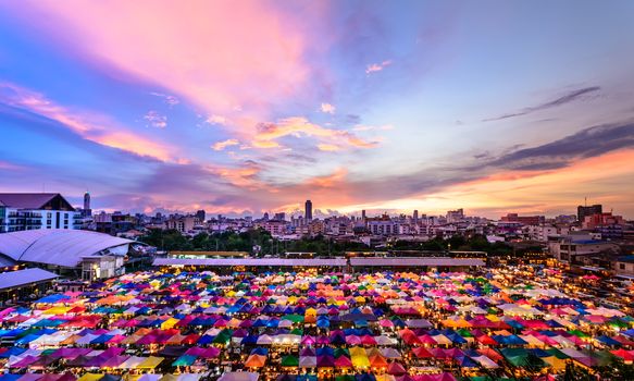 Sunset City view landscape and Colorful Market in thailand for background