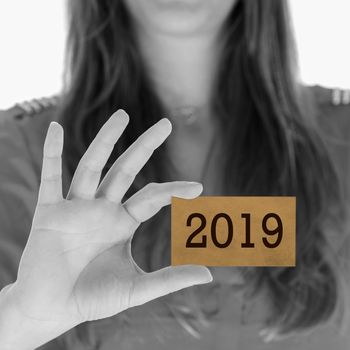 Woman showing a business card - New year - 2019