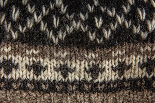 Real knitted fabric textured background. Ornament Norwegian style