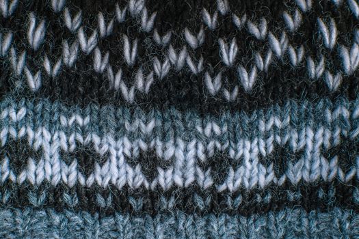 Real knitted fabric textured background. Ornament Norwegian style