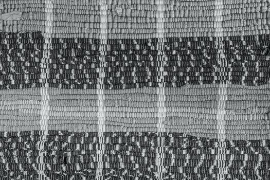 background, texture of colored handmade carpet. Fabric rug of small patches