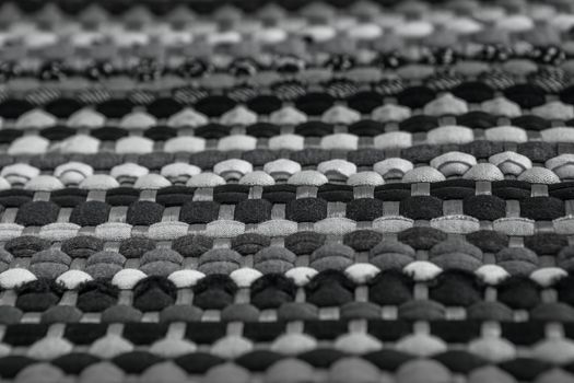 background, texture of colored handmade carpet. Fabric rug of small patches
