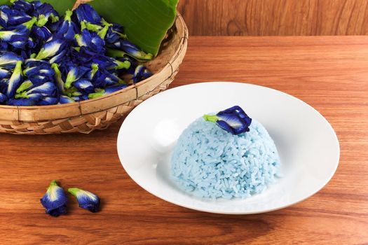 Blue Rice made cooking from Butterfly Pea flower (Clitoria ternatea L) in the white dish. Rice has a colorful and fragrant flower and good for health.