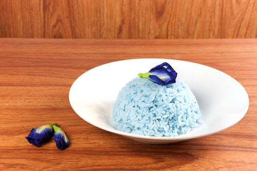 Blue Rice made cooking from Butterfly Pea flower (Clitoria ternatea L) in the white dish. Rice has a colorful and fragrant flower and good for health.