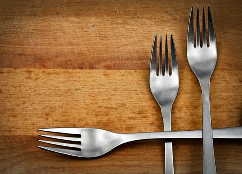 background or scene with three metal forks