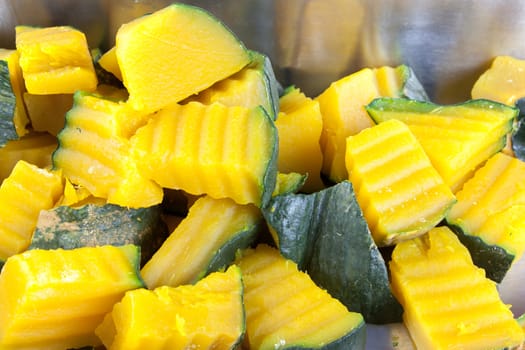 Slices of boiled pumpkin on stainless steel trays