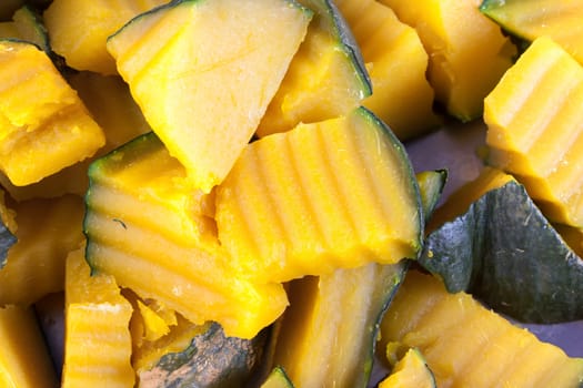 Slices of boiled pumpkin on stainless steel trays