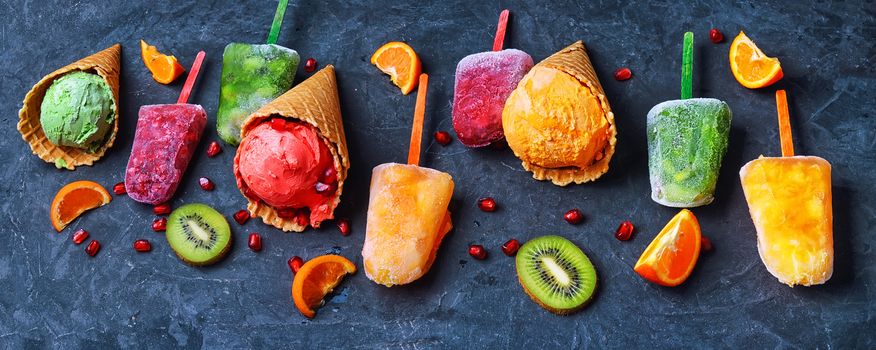 Summer ice cream assortment of fruit flavors with kiwi and pomegranate