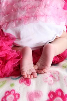 Newborn baby girl on a soft blanket