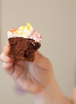 Half-eaten chocolate cupcake