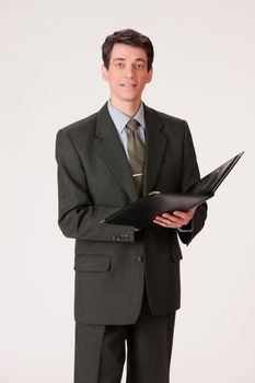 Young businessman in a suit on isolated background