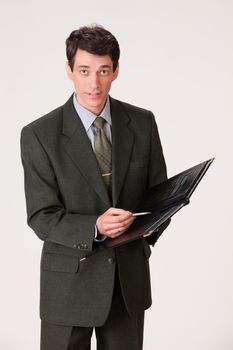Young businessman in a suit on isolated background