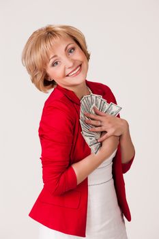Young woman with a bunch of dollar banknotes