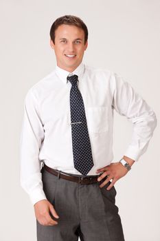 Young businessman in a suit on isolated background