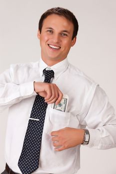 Young businessman in a suit on isolated background