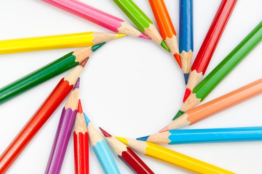 Pattern of color pencils isolated on white background close up