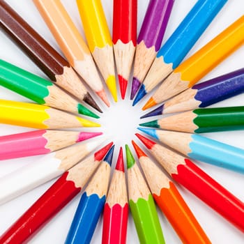 Pattern of color pencils isolated on white background close up