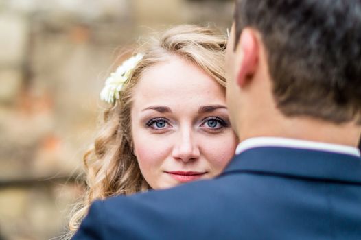 Portrait of a bride from the groom in the city