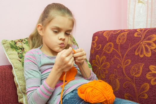 The girl thought doing Knitting