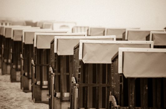 Strandkorb, Strandkoerbe in Rugen, Germany, Beach chairs on the sandy beach in Binz