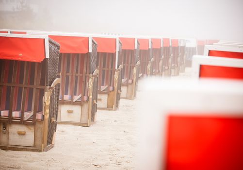 Strandkorb, Strandkoerbe in Rugen, Germany, Beach chairs on the sandy beach in Binz