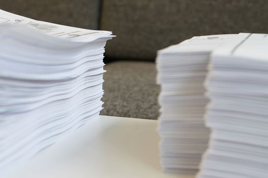 Stack of white papers sheet was organized  on office background.                               