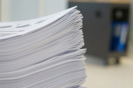Stack of white papers sheet was organized  on office background.                               