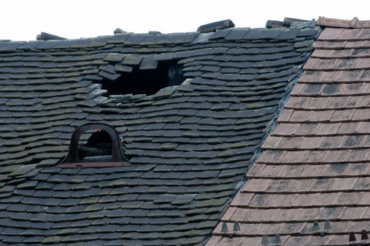 Damaged old tiled roof broken leaked