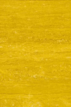 Textured marble background texture pattern with yellowish tones