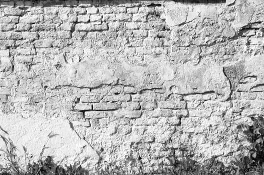 Textured old brick wall background,monochrome