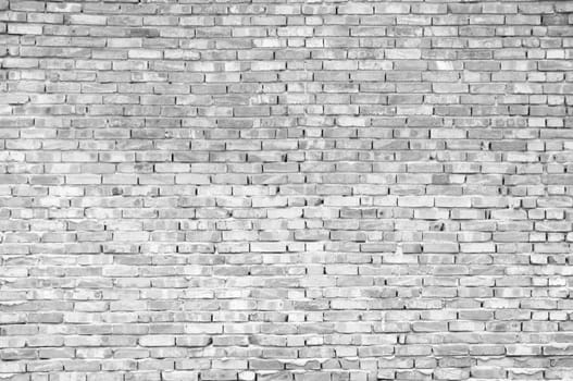 Textured old brick wall background,monochrome