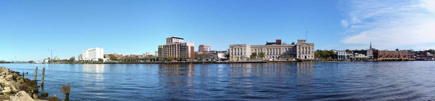 A view of Wilmington North Carolina from across the Cape Fear River. The photo is a panoramic shot.