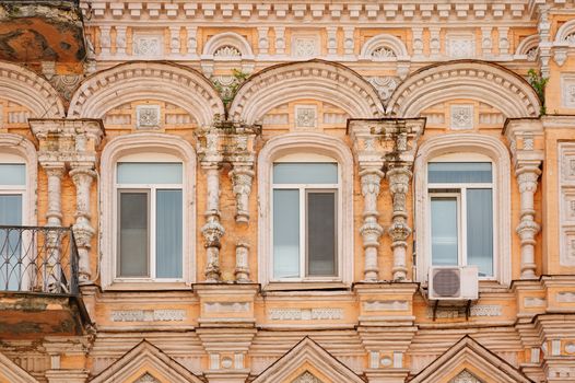 multi-story historic building with windows in city