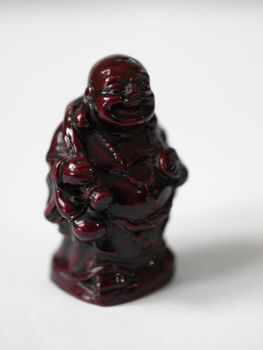 LAUGHING BUDDHA STATUE CARRYING A BAG