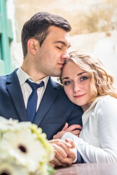 newlyweds sitting in the Cafe at the table