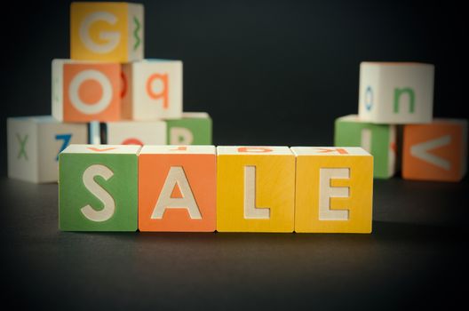 SALE word with colorful blocks. sale bonus seller buy block business concept