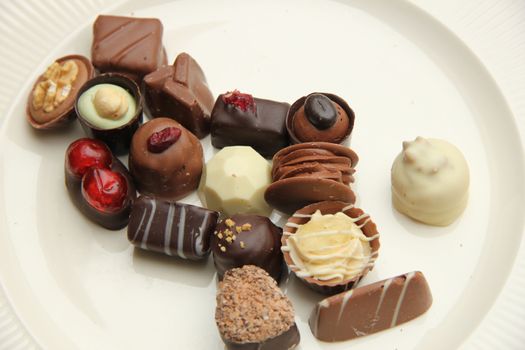 Delicious chocolates from Belgium, decorated with nuts and fruits