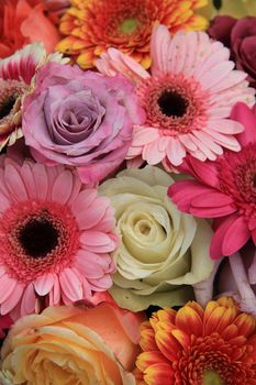 Gerberas and roses in bright colors in a bridal bouquet