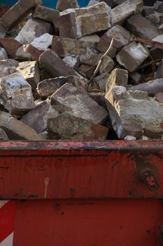 Loaded dumpster near a construction site, home renovation