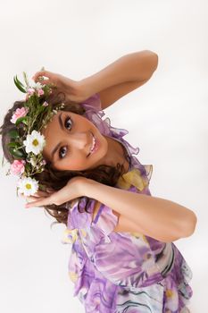 Young woman with flowers on isolated background