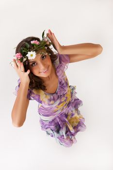 Young woman with flowers on isolated background