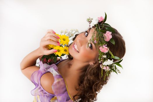 Young woman with flowers on isolated background