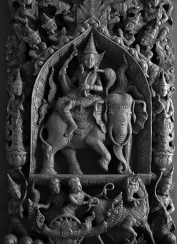 BLACK AND WHITE PHOTO OF WOOD CARVING