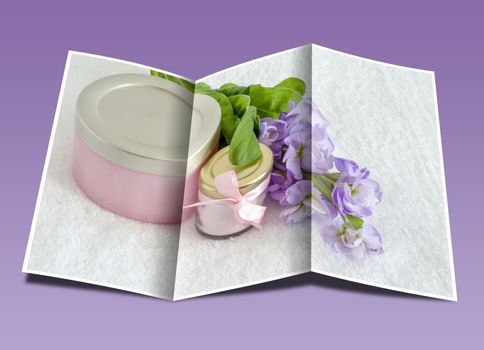 brochure a jar of face powder and a jar of cream on a white towel