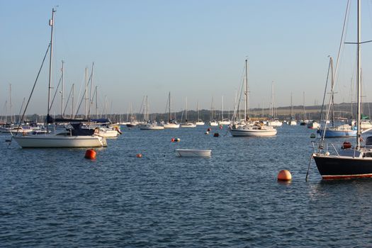 boats at anchor on a blue clam sea