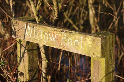 wooden sign showing willow pool