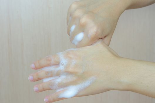 Woman washing her hands