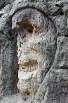 Scary Stone Heads - rock sculptures of giant heads carved into the sandstone cliffs in the pine forest above the village Zelizy in the district Melnik, Czech republic. It is the works of sculptor Vaclav Levy, who created in the period 1841-1846.