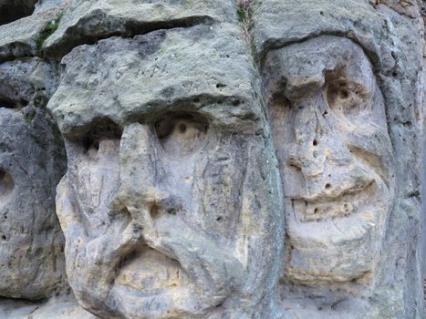 Scary Stone Heads - rock sculptures of giant heads carved into the sandstone cliffs in the pine forest above the village Zelizy in the district Melnik, Czech republic. It is the works of sculptor Vaclav Levy, who created in the period 1841-1846.