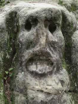 Scary Stone Heads - rock sculptures of giant heads carved into the sandstone cliffs in the pine forest above the village Zelizy in the district Melnik, Czech republic. It is the works of sculptor Vaclav Levy, who created in the period 1841-1846.